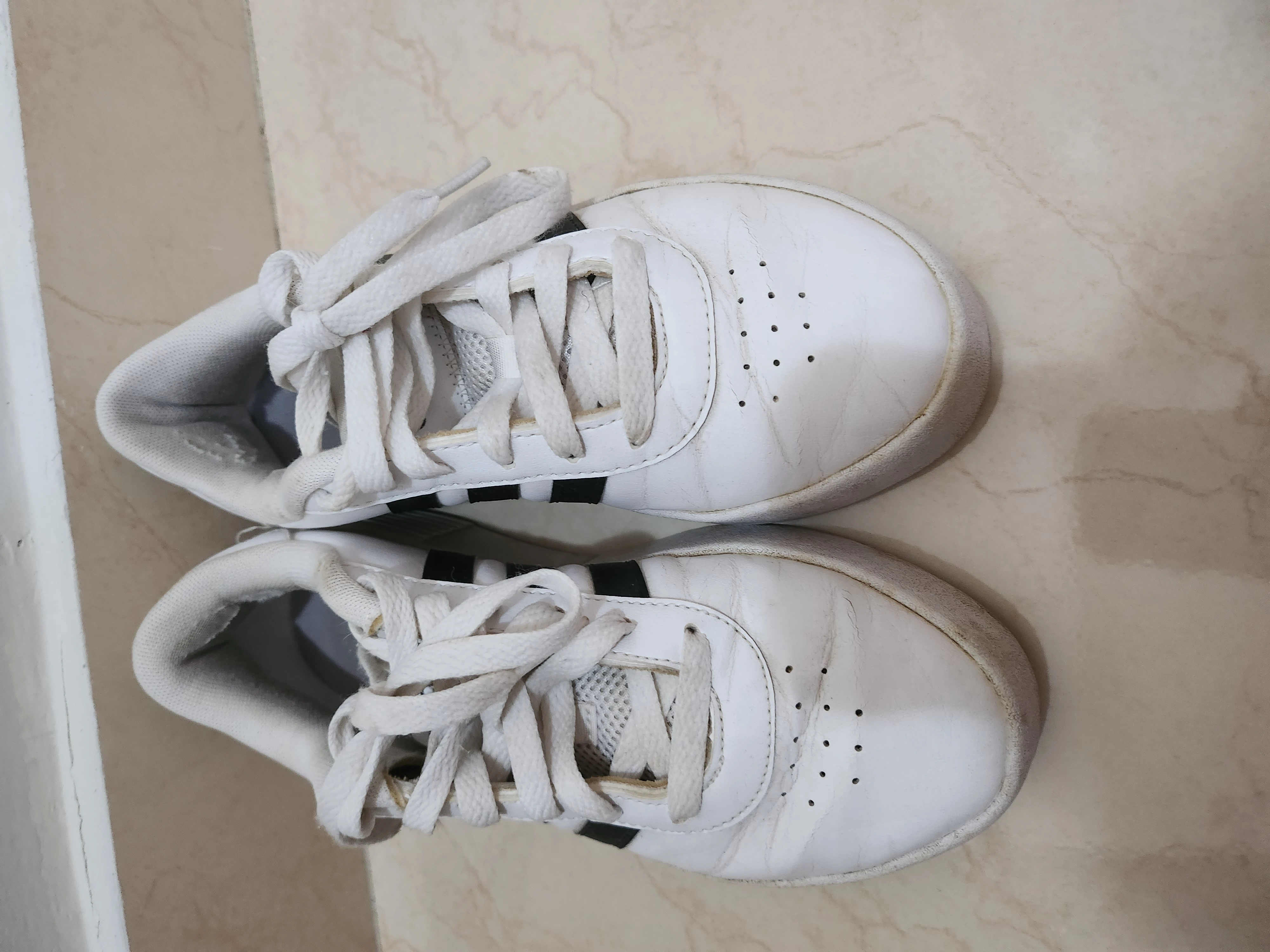 White and black Adidas shoes