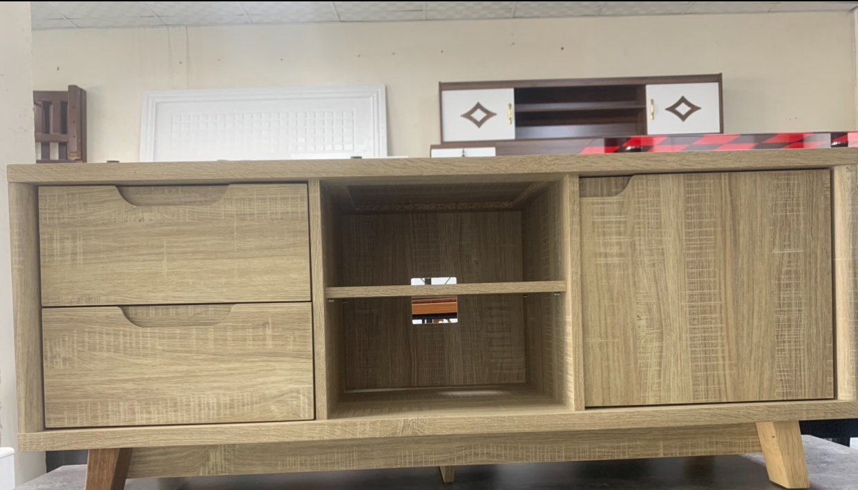 Beige wooden TV stand with shelves and drawers